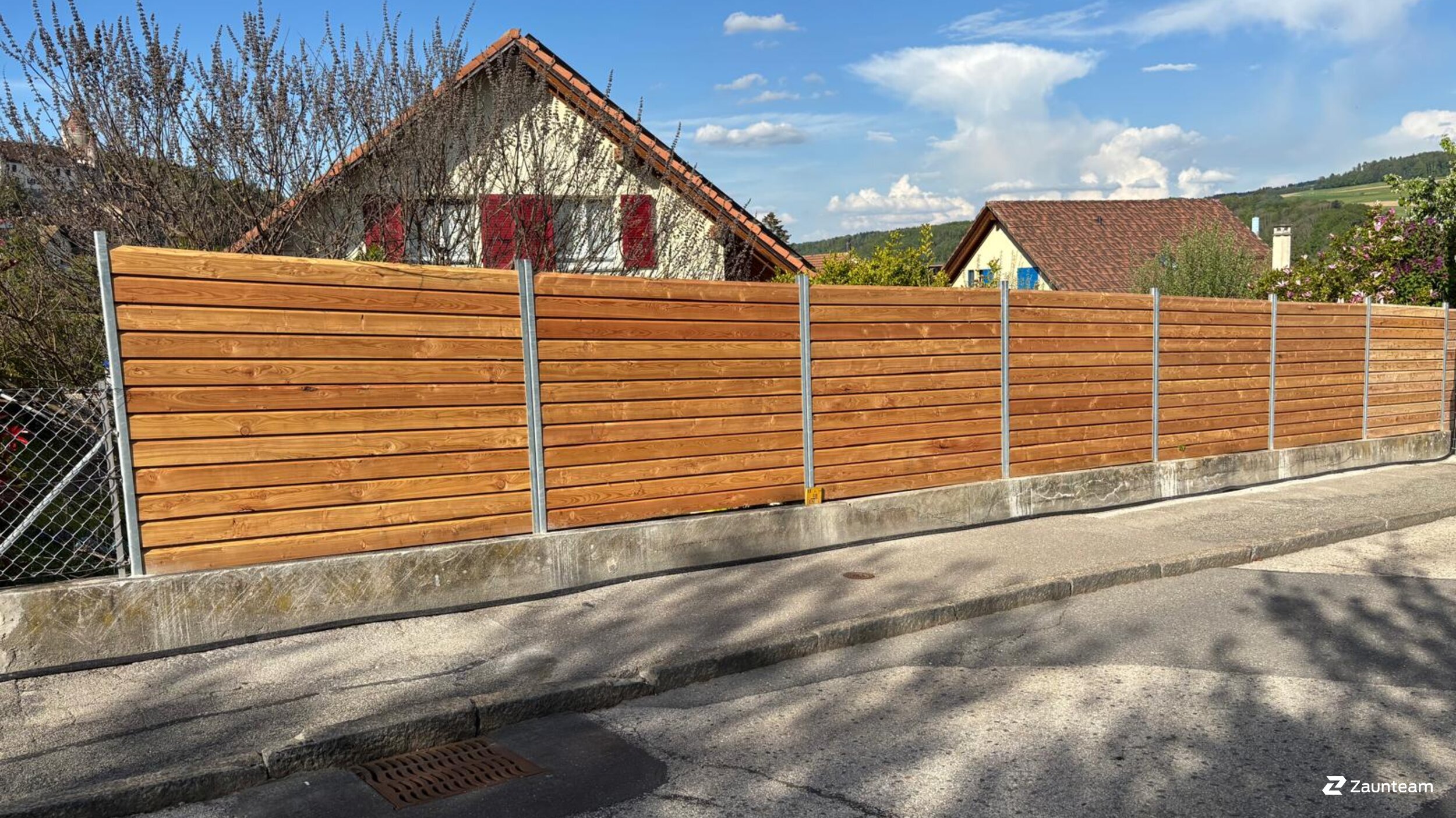 Protection brise-vue en bois de 2025 à 1522 Lucens Suisse de Swissclôture Nord Vaudois.