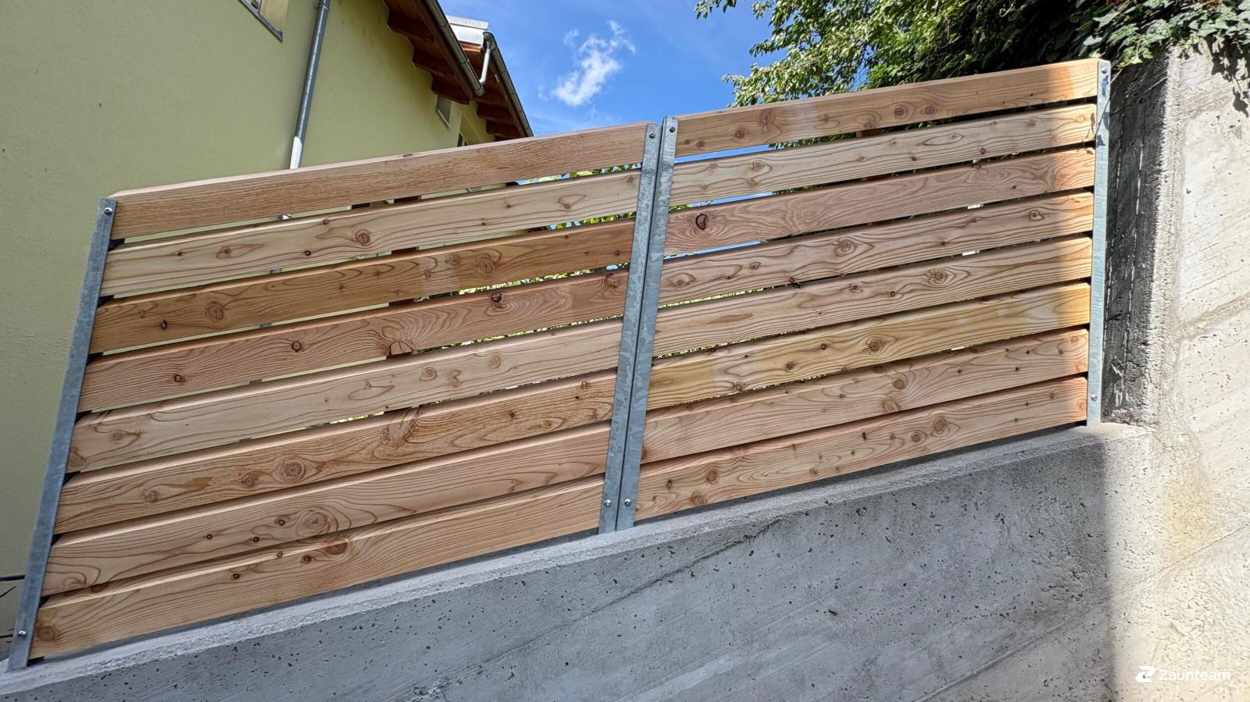 Protection brise-vue en bois de 2026 à 3930 Visp Suisse de Zaunteam Wallis / Swissclôture Valais.